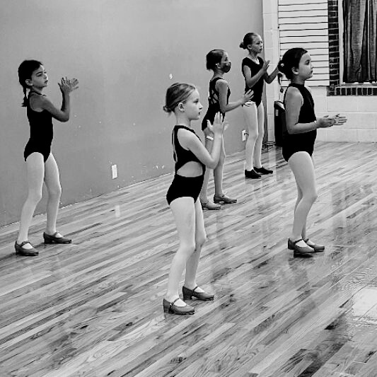 Young dancers engaged in a tap class at the Charleston Dance Center facility.