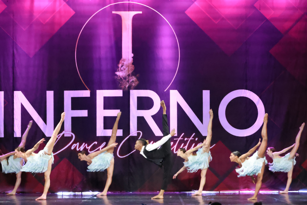 Company dancers from Charleston Dance Center performing a group routine on stage at Inferno Dance Competition.